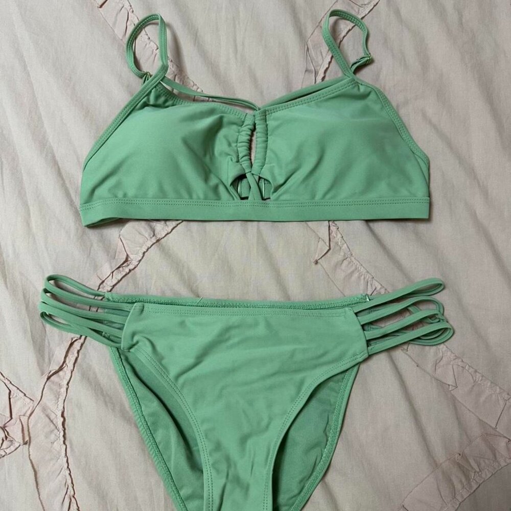 BluC sage green bikini set with strappy bottom and top details.
